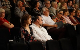 The audience watching the performance